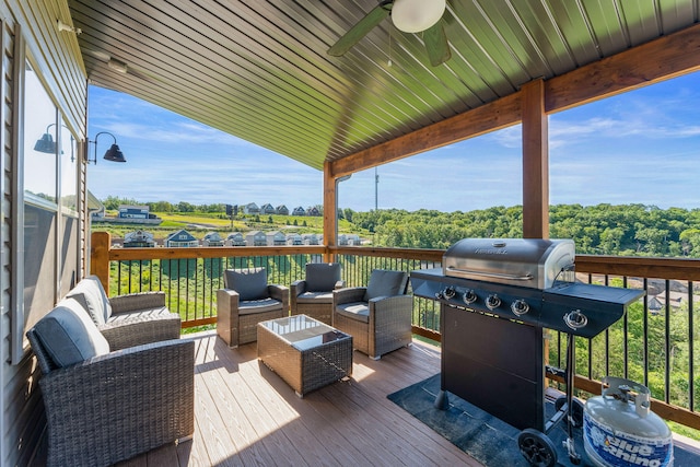 deck featuring outdoor lounge area, ceiling fan, and a grill