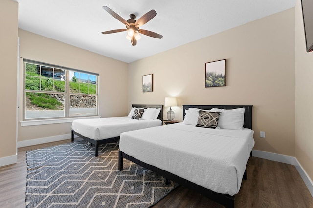 bedroom with ceiling fan and hardwood / wood-style floors