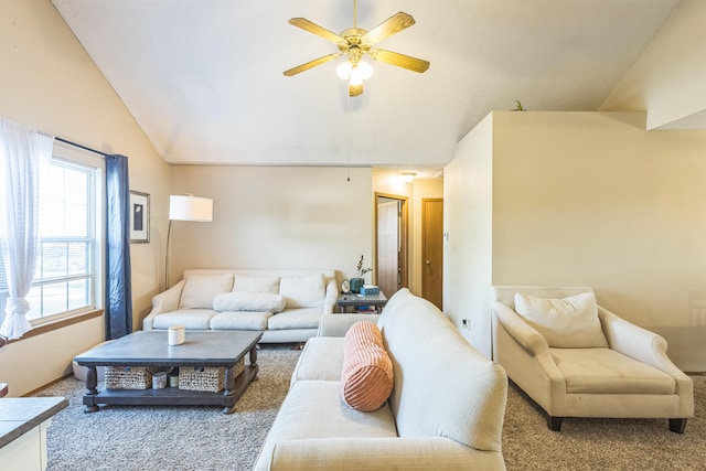 living room featuring lofted ceiling, carpet floors, and ceiling fan