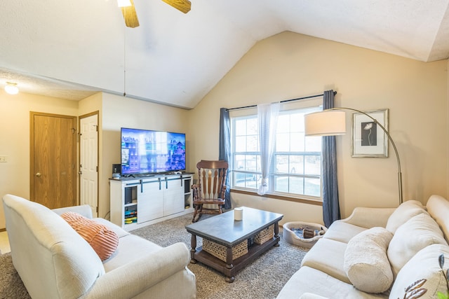 living room with ceiling fan, vaulted ceiling, and carpet floors