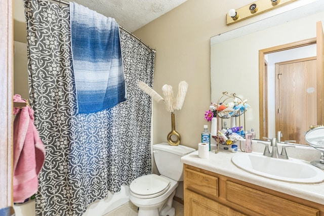 full bathroom featuring vanity, toilet, a textured ceiling, and shower / tub combo with curtain