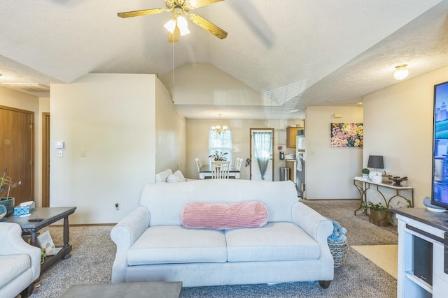 carpeted living room featuring lofted ceiling, a textured ceiling, and ceiling fan with notable chandelier