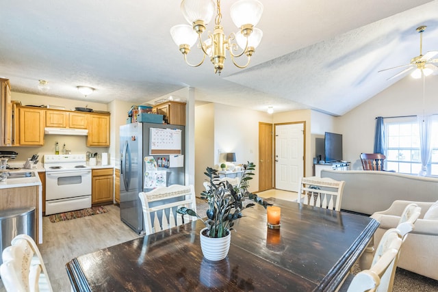 dining room featuring lofted ceiling, light hardwood / wood-style floors, sink, a textured ceiling, and ceiling fan with notable chandelier