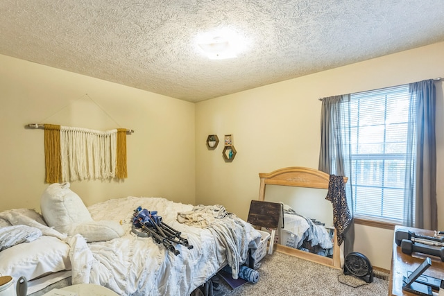 carpeted bedroom featuring a textured ceiling