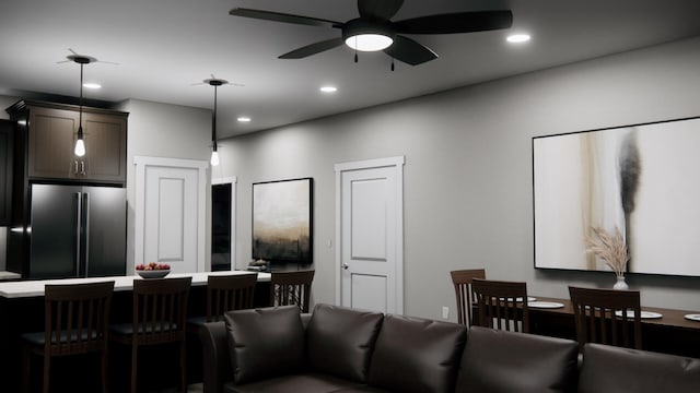 living area featuring recessed lighting and ceiling fan