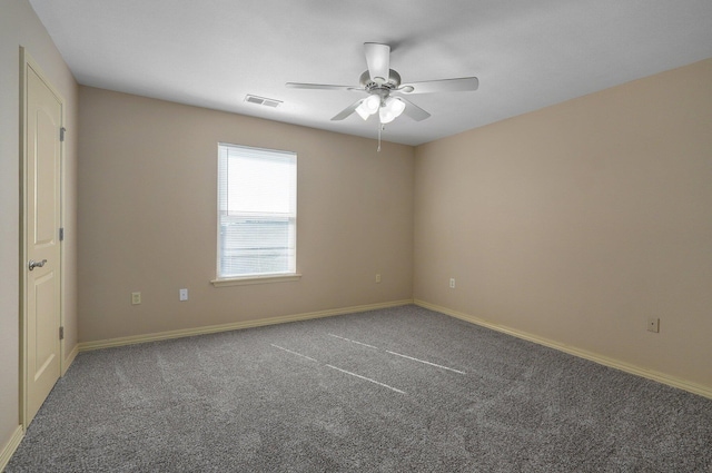 spare room with baseboards, a ceiling fan, and carpet flooring