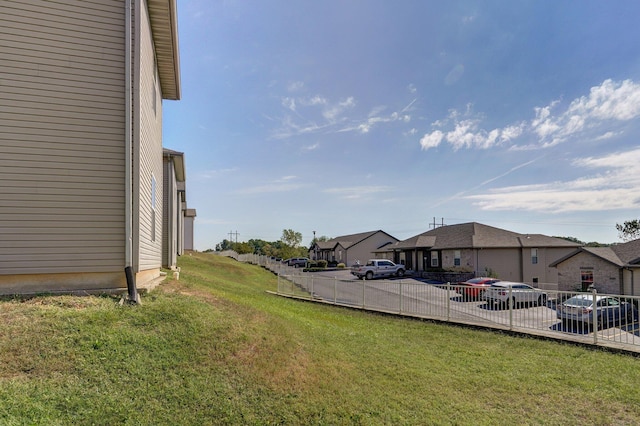 view of yard with fence and a residential view
