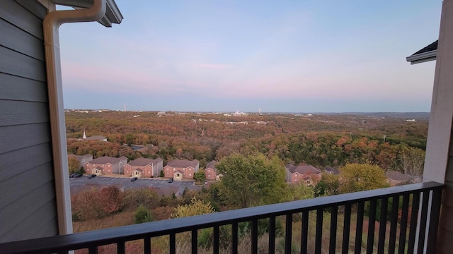 view of balcony at dusk