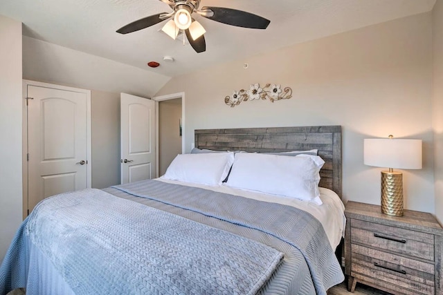 bedroom featuring ceiling fan and lofted ceiling