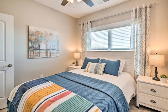 bedroom featuring ceiling fan and wood-type flooring