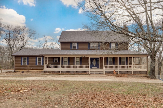 287 Oak Grove Ln, Galena, MO 65656 - farmhouse inspired home with covered porch, roof with shingles, a chimney, and a front lawn