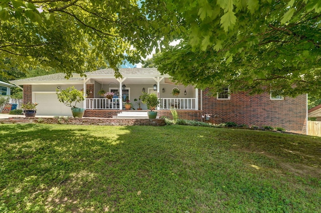 view of front of home with a garage, a porch, and a front lawn