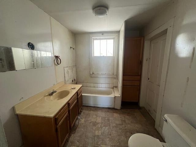 full bathroom with shower / bathing tub combination, vanity, and toilet