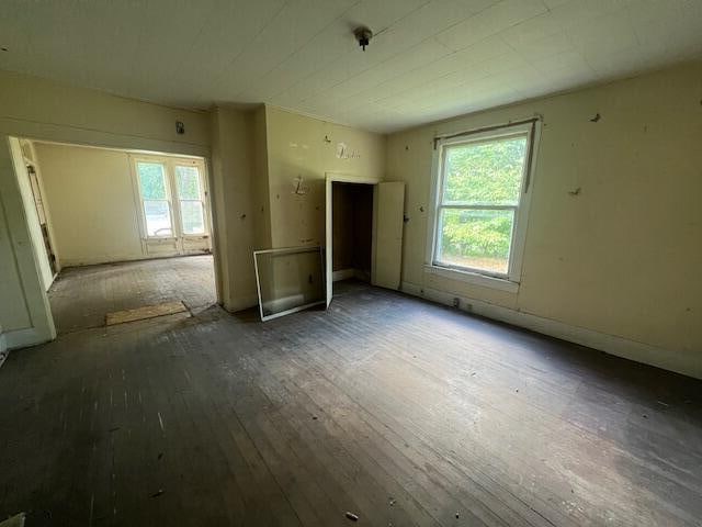 spare room featuring dark hardwood / wood-style flooring