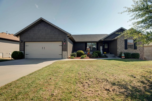 view of front of house featuring a front lawn and a garage