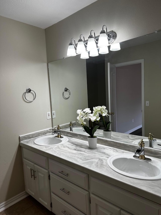 bathroom with tile patterned flooring and vanity