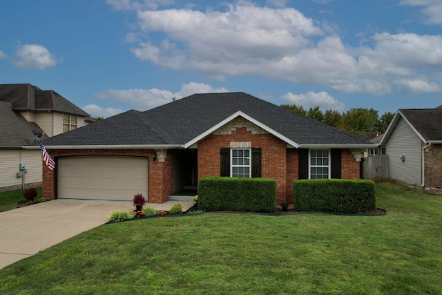 view of front facade with a garage and a front lawn