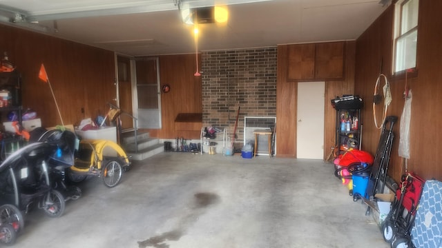 garage featuring wooden walls