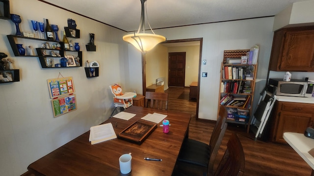 dining room featuring dark hardwood / wood-style flooring