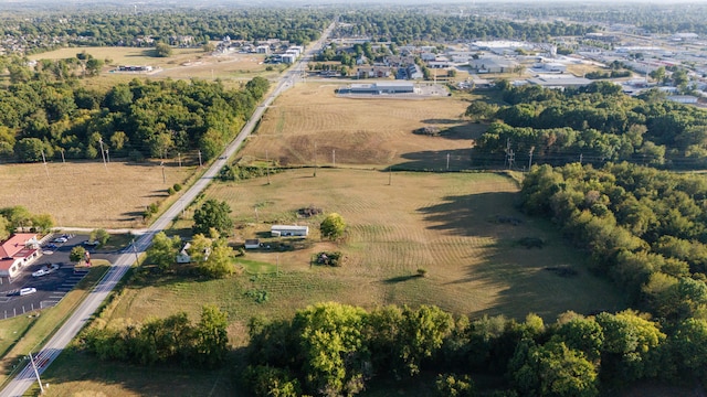 birds eye view of property with a rural view