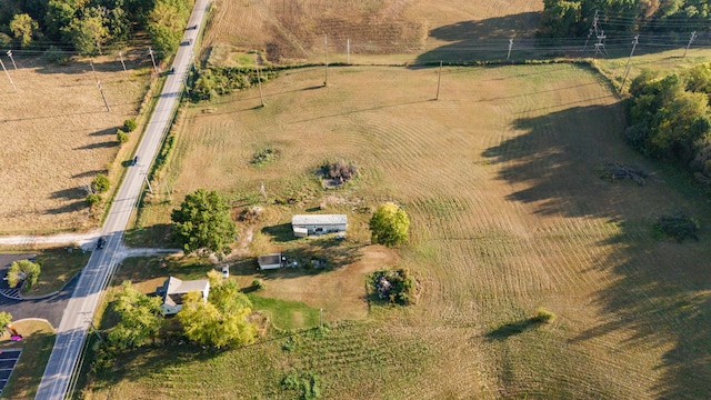 birds eye view of property with a rural view