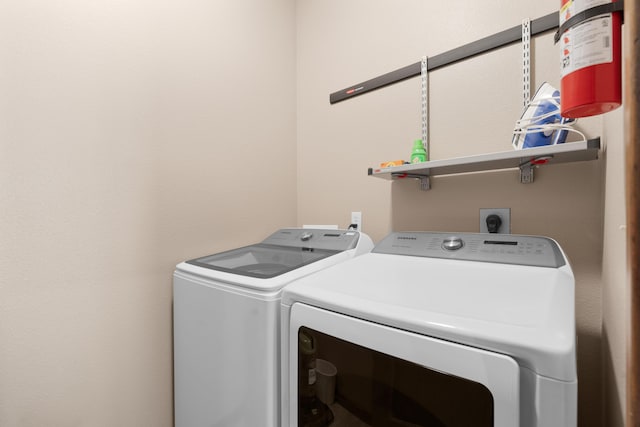 laundry room with washing machine and dryer and laundry area