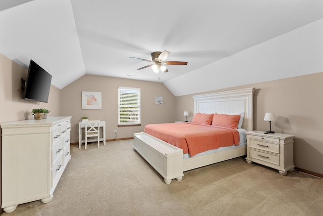 bedroom with baseboards, lofted ceiling, light colored carpet, and ceiling fan