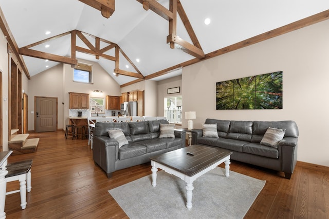 living room with baseboards, beam ceiling, high vaulted ceiling, and dark wood-style flooring