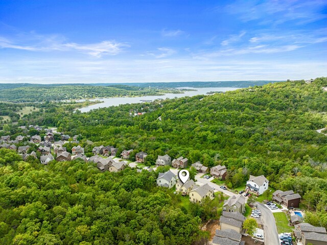 bird's eye view with a forest view, a residential view, and a water view