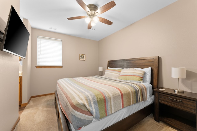 bedroom featuring ceiling fan and light carpet