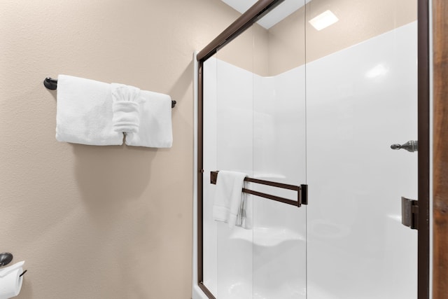 bathroom with a stall shower