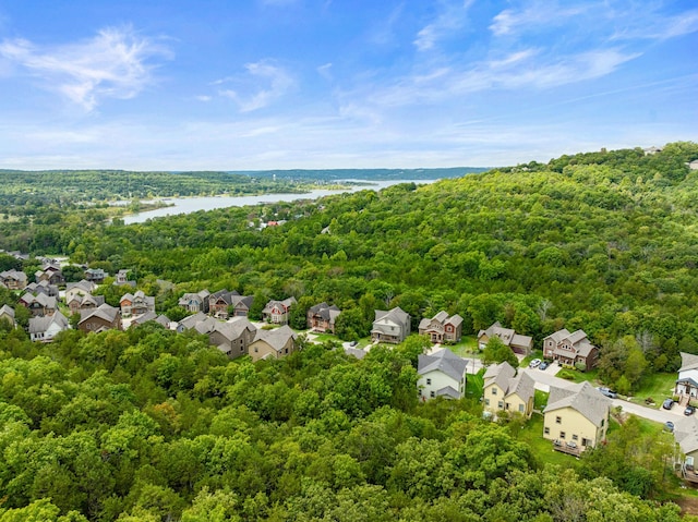 bird's eye view featuring a residential view, a view of trees, and a water view