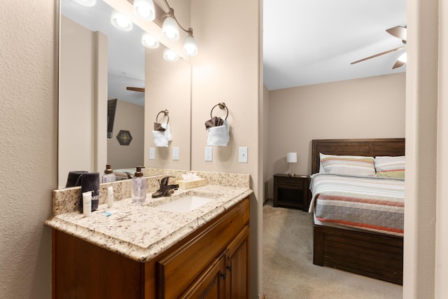 bathroom with ceiling fan and vanity