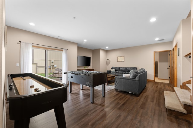 game room with dark hardwood / wood-style floors