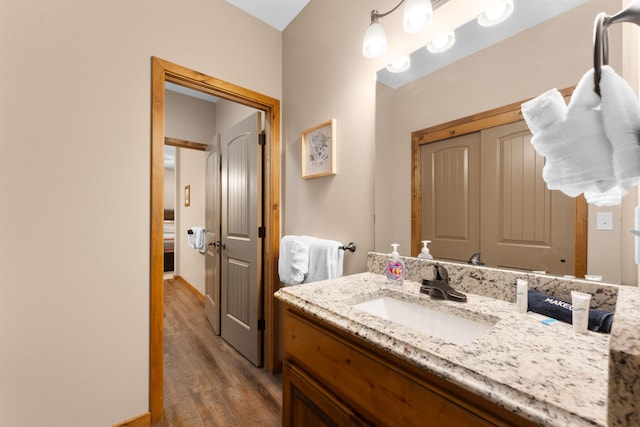 bathroom featuring vanity and hardwood / wood-style floors