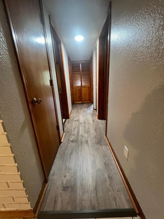 corridor featuring light hardwood / wood-style floors