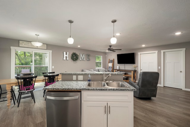 kitchen with white cabinetry, dishwasher, sink, and pendant lighting