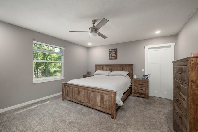 carpeted bedroom featuring ceiling fan