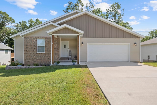 view of front of property with a garage and a front yard