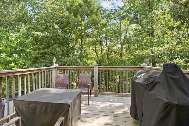 wooden deck featuring grilling area