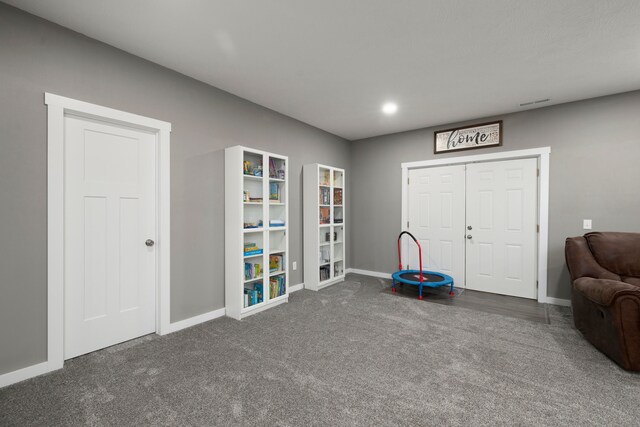 sitting room with dark carpet