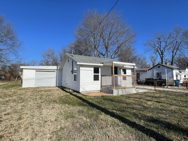 exterior space with a front yard, a porch, and a garage