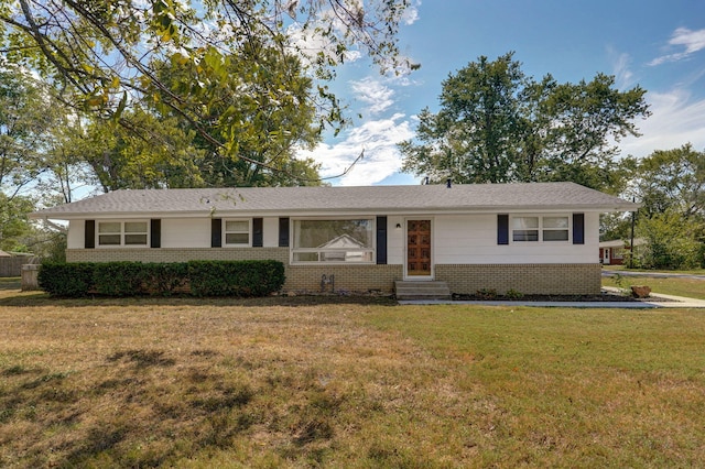 ranch-style home featuring a front yard