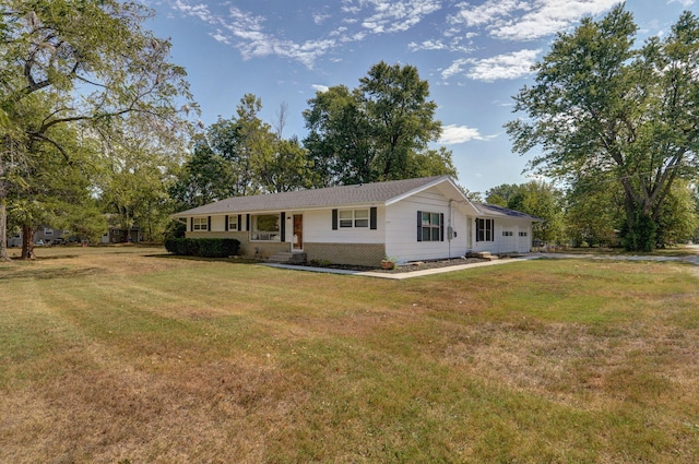 rear view of house featuring a lawn