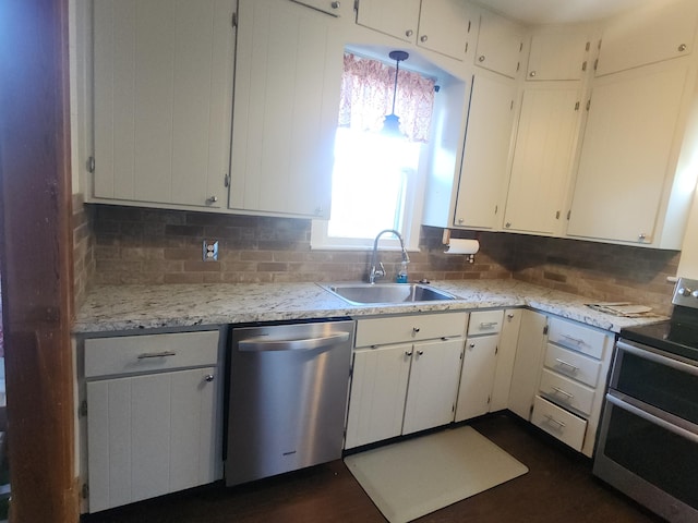 kitchen featuring white cabinetry, sink, stainless steel appliances, and backsplash