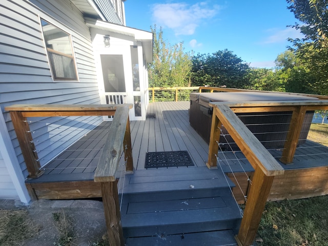 wooden deck with a jacuzzi