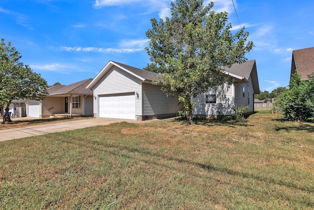 ranch-style home with concrete driveway, a front yard, and a garage