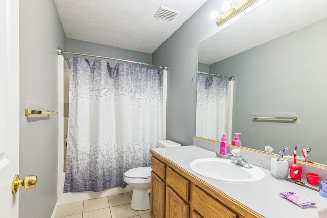 bathroom with vanity, a textured ceiling, tile patterned floors, toilet, and a shower with shower curtain