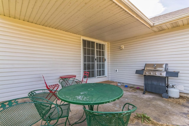 view of patio with a grill and outdoor dining space