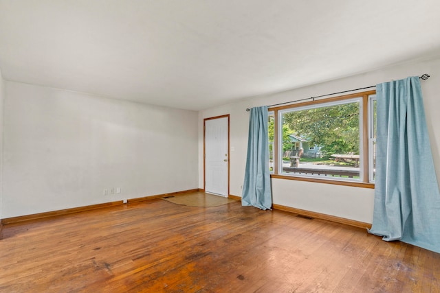 spare room featuring hardwood / wood-style flooring